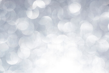 Silver white glittering Christmas lights. Blurred abstract background