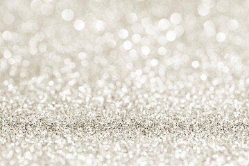 Golden beige white glittering Christmas lights. Gold Festive Christmas background.