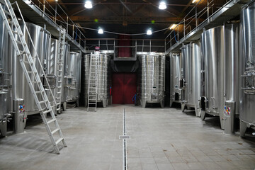 Wine industry storage and production facility with wine barrels