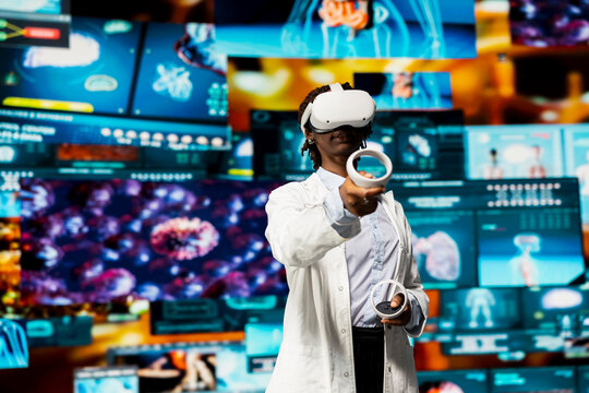 Researcher looking at CT scans using VR headset gear. Female scientist analyzing neurology research charts using virtual reality technology, looking at pictures of human organs - Powered by Adobe