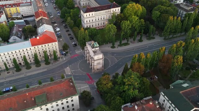 Munich aerial panorama at sunrise featuring Siegestor, iconic triumphal arch, Bavaria with lions, Ludwigstrasse, Munich, Germany, perfect for cinematic cityscapes, European architecture, and travel
