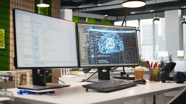 PC in empty IT startup office displaying artificial intelligence programming languages used for building applications. Computer showing machine learning code in software development agency