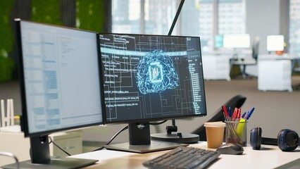 Empty startup office with artificial intelligence program running on PC monitors used by...