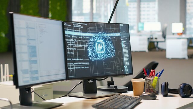 Empty startup office with artificial intelligence program running on PC monitors used by programmers. AI industry startup workspace leveraging machine learning technology - Powered by Adobe
