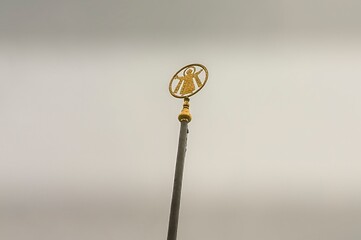 Munich city symbol Monk, Muenchner Kindl, coat of arms of Munich on the top of a flagpole in the Odeonsplatz Square, Bavaria, Germany