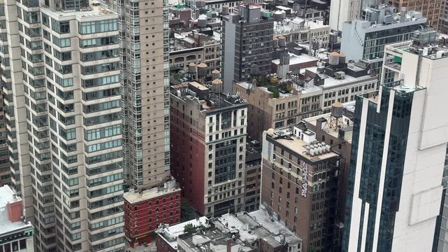 Day scene of top view of New York City Manhattan street with traffic and skyscrapers around