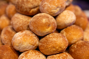 Freshly baked bread rolls in a wooden basket, perfect for breakfast or bakery product marketing, delicious golden crust and soft texture. Mini bread baguettes in basket. pieces to accompany food
