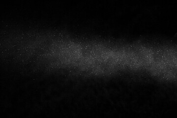 Obraz premium Snowflakes falling down on black background, heavy snowflakes isolated, Flying rain, overlay effect for composition Christmas background, white snow on black background for edit photo. Blizzard