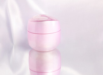 Pink cosmetic jar, face cream, skin care product, beauty product