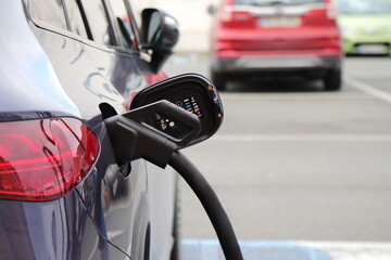 Electric car charge station, eco friendly recharge on parking