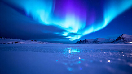 Aurora borealis illuminates a snowy landscape with vibrant blue and purple hues over a frozen lake at night