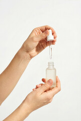Precise Application Of Serum Onto Frosted Bottle Using Glass Dropper In Laboratory Setting