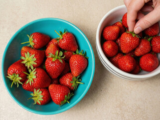 Sweet Ripe Strawberries Nestled In Glossy Ceramic Bowls On Countertops