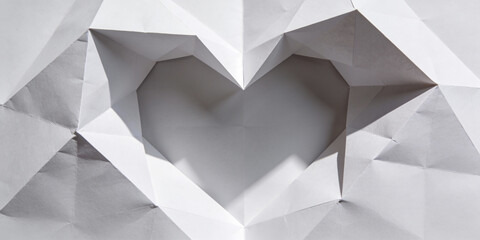 Large Geometric Paper Folds Creating Heart Shape in Minimalistic Background with Soft Shadows and Facets