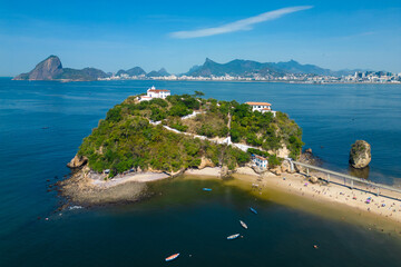 Aerial View of Boa Viagem Private Island in Niteroi City at Guanabara Bay and Rio de Janeiro Mountain Landscape in the Horizon