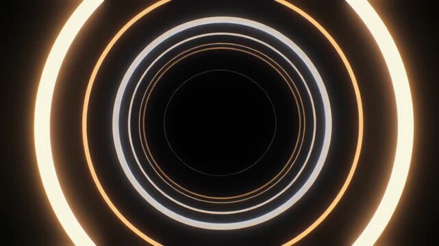 Animated abstract golden rings in smooth circular motion over deep black background with glowing metallic light and elegant futuristic atmosphere