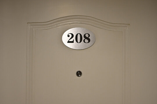 Hotel Room Door with Number 208