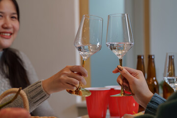 Party celebration with toasting glasses and joyful friends