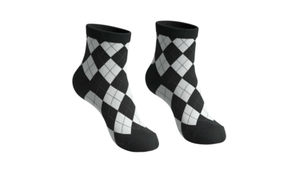 Pair of argyle socks, black and white diamond pattern, isolated on a black background