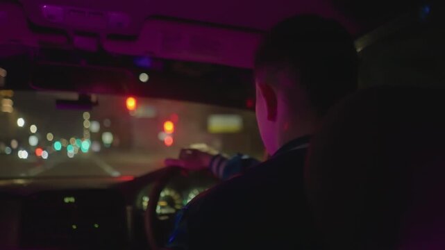 night downtown drive, black man grips steering wheel in dim neon glow close interior shots capture hands on wheel, dashboard lights, reflective windshield, and quiet introspection after long shift
