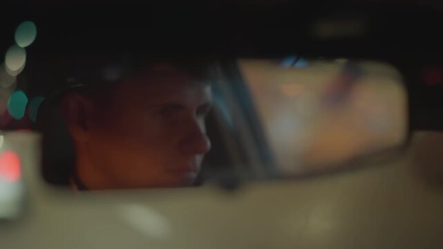 rear mirror portrait focused driver staring through city night, reflective glass catching neon bokeh, tight closeup on eyes, security patrol vibe, delivery shift, rideshare commute, quiet tension,