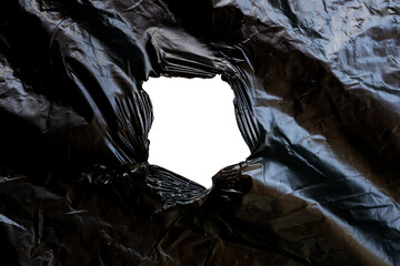 black plastic torn in the middle transparent
