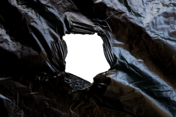 black plastic torn in the middle transparent
