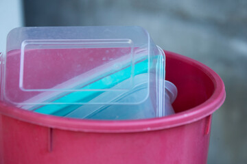 Plastic containers in the trash can, closeup of photo.