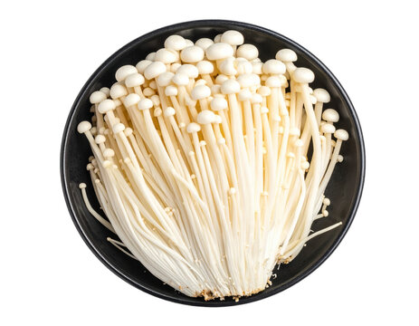 Overhead view of enoki mushrooms in black bowl