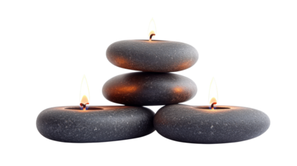 A stack of three stones with candles on top of them. The candles are lit and the stones are black. Concept of calm and relaxation, as the candles and stones create a peaceful atmosphere