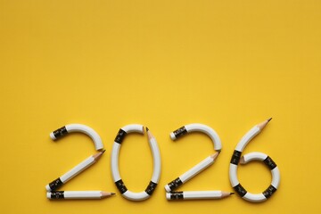 2026 Pencils New Year Concept on Yellow Background
