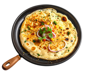Golden roti flatbread with vegetables and herbs in a black skillet on white