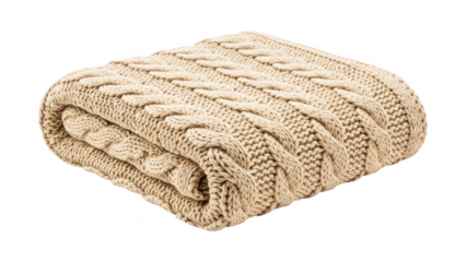 A folded beige knitted blanket with a cable knit pattern on a transparent background