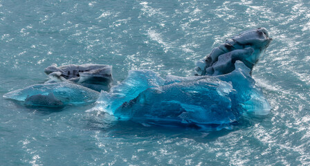 a high angle shot of a beautiful blue iceberg at perito moreno glacier in los glaciares national park of argentina
