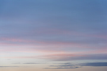 Obraz premium Soft Pink and Blue Sunset Sky with Clouds