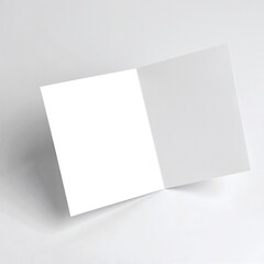 A pristine white square card featuring two distinct sides, one side smooth and glossy, while the other has a textured finish, perfect for creative projects.