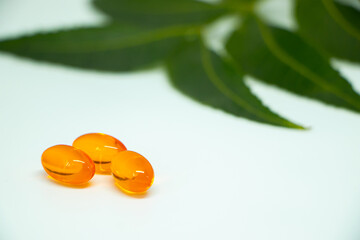vitamin e capsules isolated on a white medicine background