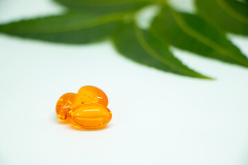 vitamin e capsules isolated on a white medicine background