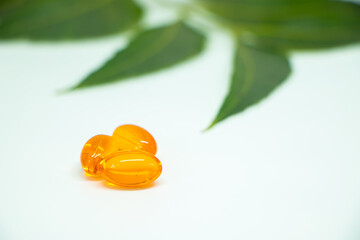 vitamin e capsules isolated on a white medicine background