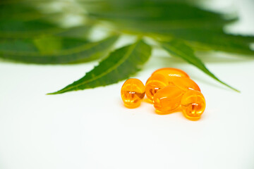 Healthcare concept. Vitamin e capsule isolated on white with medicine background.