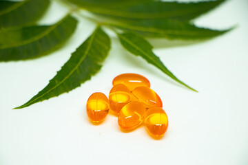 Healthcare concept. Vitamin e capsule isolated on white with medicine background.