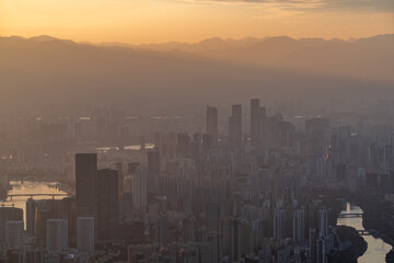 Fototapeta premium Sunset Over Urban Skyline with Skyscrapers
