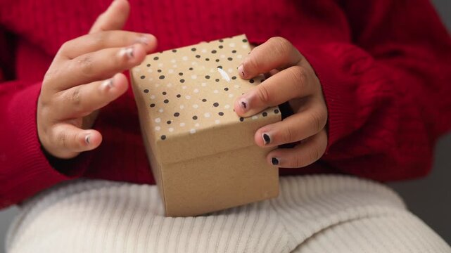 little girl Opening a gift box with a simple design