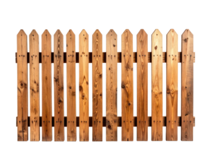 A wooden fence with pointed tops against a black background