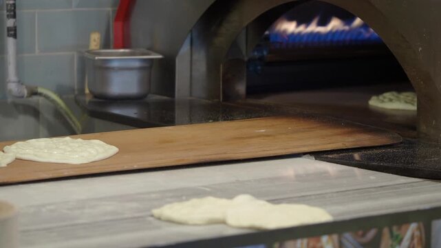 Making pizza dough and baking in a hot oven
