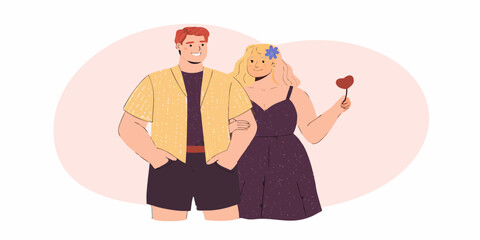 A happy couple embracing with a woman holding a red heart shape