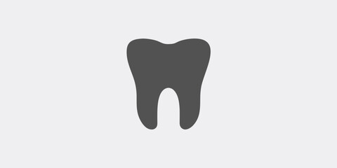 Simple illustration of a single dark tooth against a light gray background