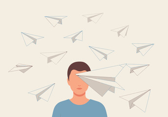 Person with paper airplanes flying around their head, one obscuring their eye.
