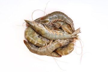 Fresh raw white shrimps isolated on white. Image top view