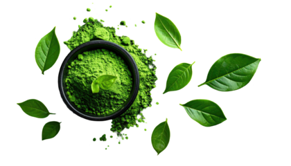 Vivid overhead of a green powder in a bowl, surrounded by fresh leaves